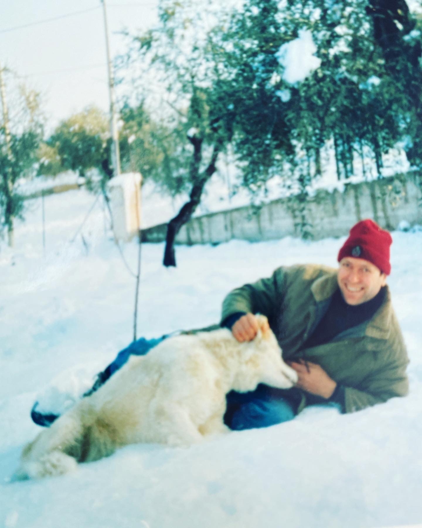 Nicola's father holding a small dog